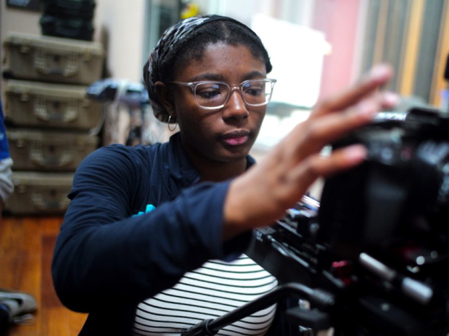 Student working with a video camera