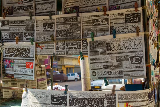 Closeup shot of Urdu newspapers on a newsstand