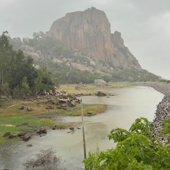 Lush green mountains with a river flowing between