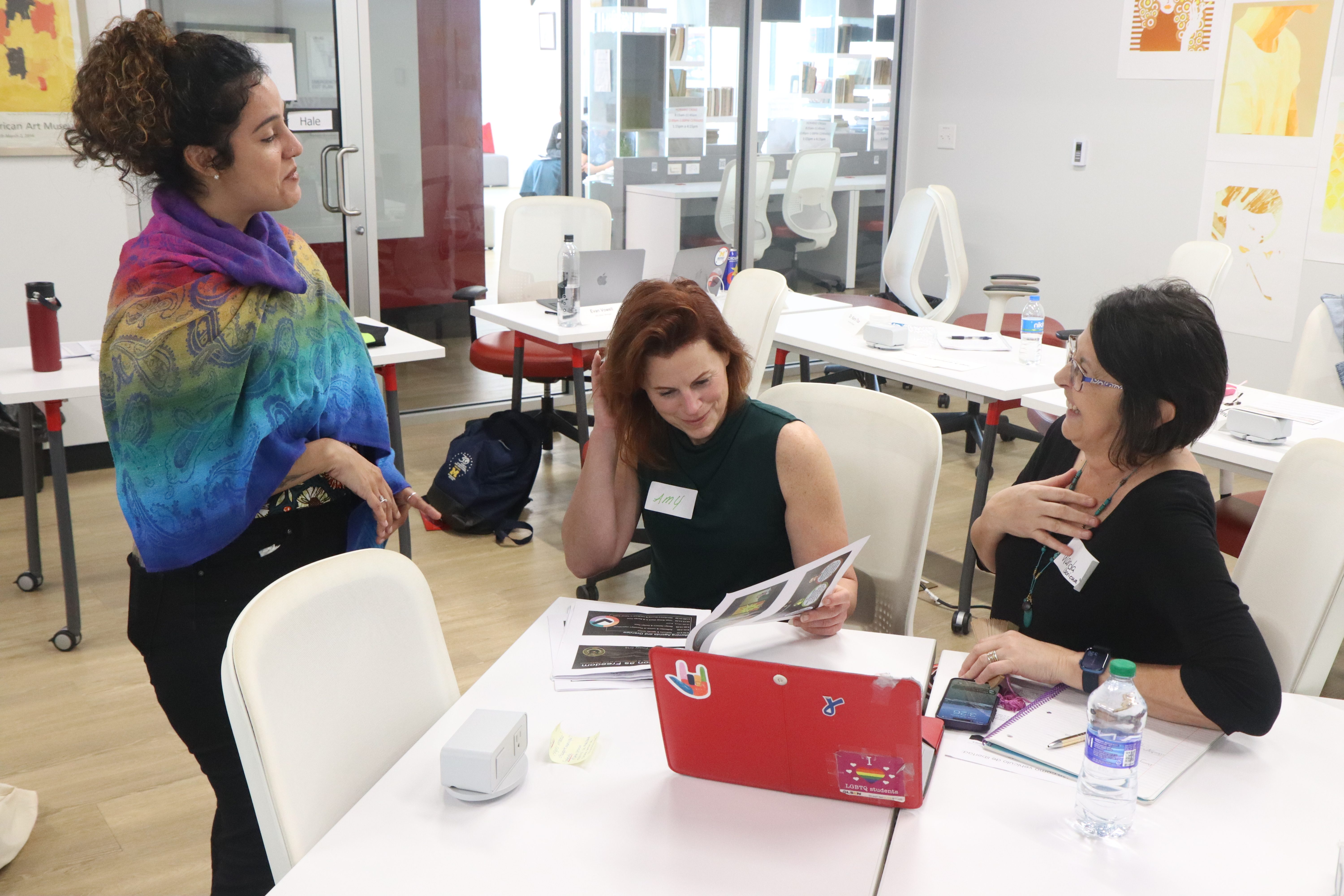 image of three teachers in discussion