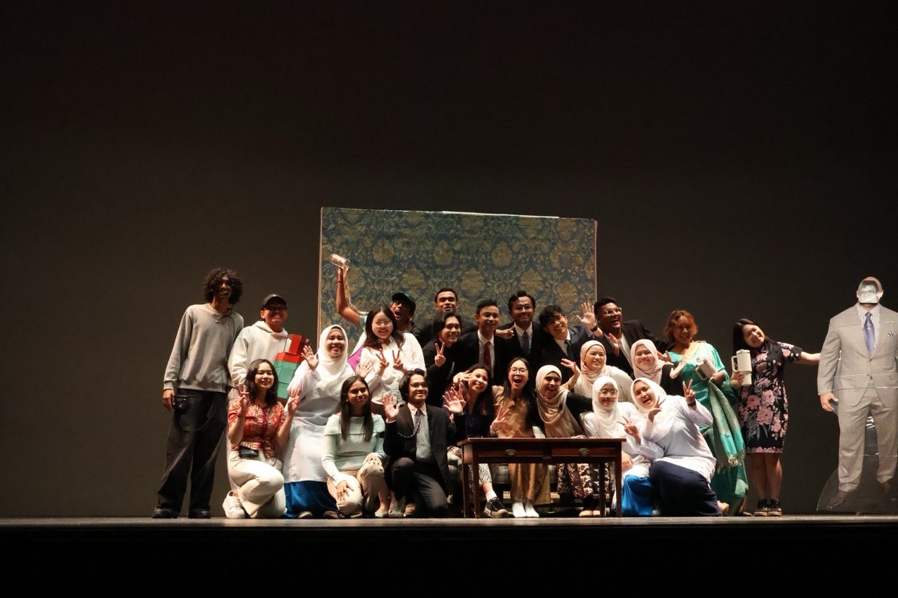 Final curtain call with cast and crew.
