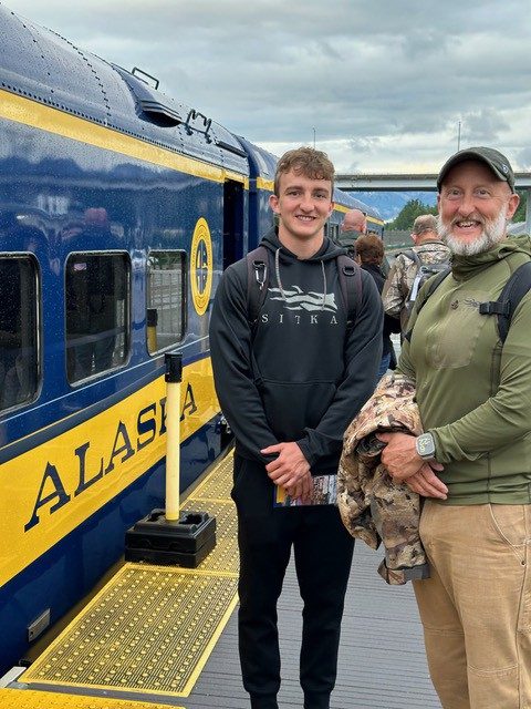 Anders Foltz interned with the Inuit Circumpolar Council in Anchorage, Alaska. He stands here next to another man, near a train.