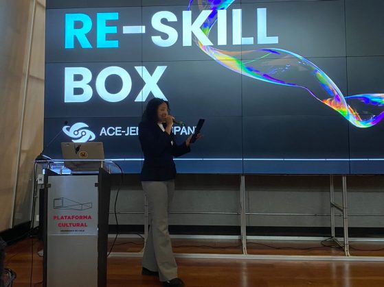 Ashley Smith speaks on the stage of the Association of Pacific Rim Universities conference in Santiago, Chile