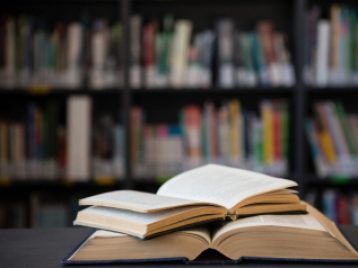 Close up of open books on table
