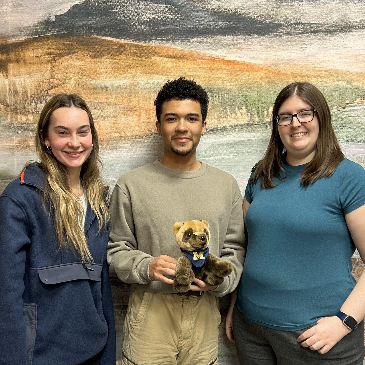 Left to right: Caitlin Hagen and Isaiah Crawford, Winter 2024 Charles University study abroad students, and Senior Study Abroad Advisor Callie Rouse pose for a picture at the UPCES Center.