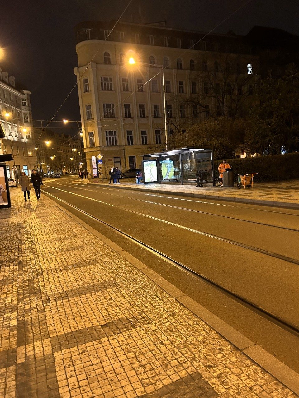 Waiting for the tram at night in Prague.