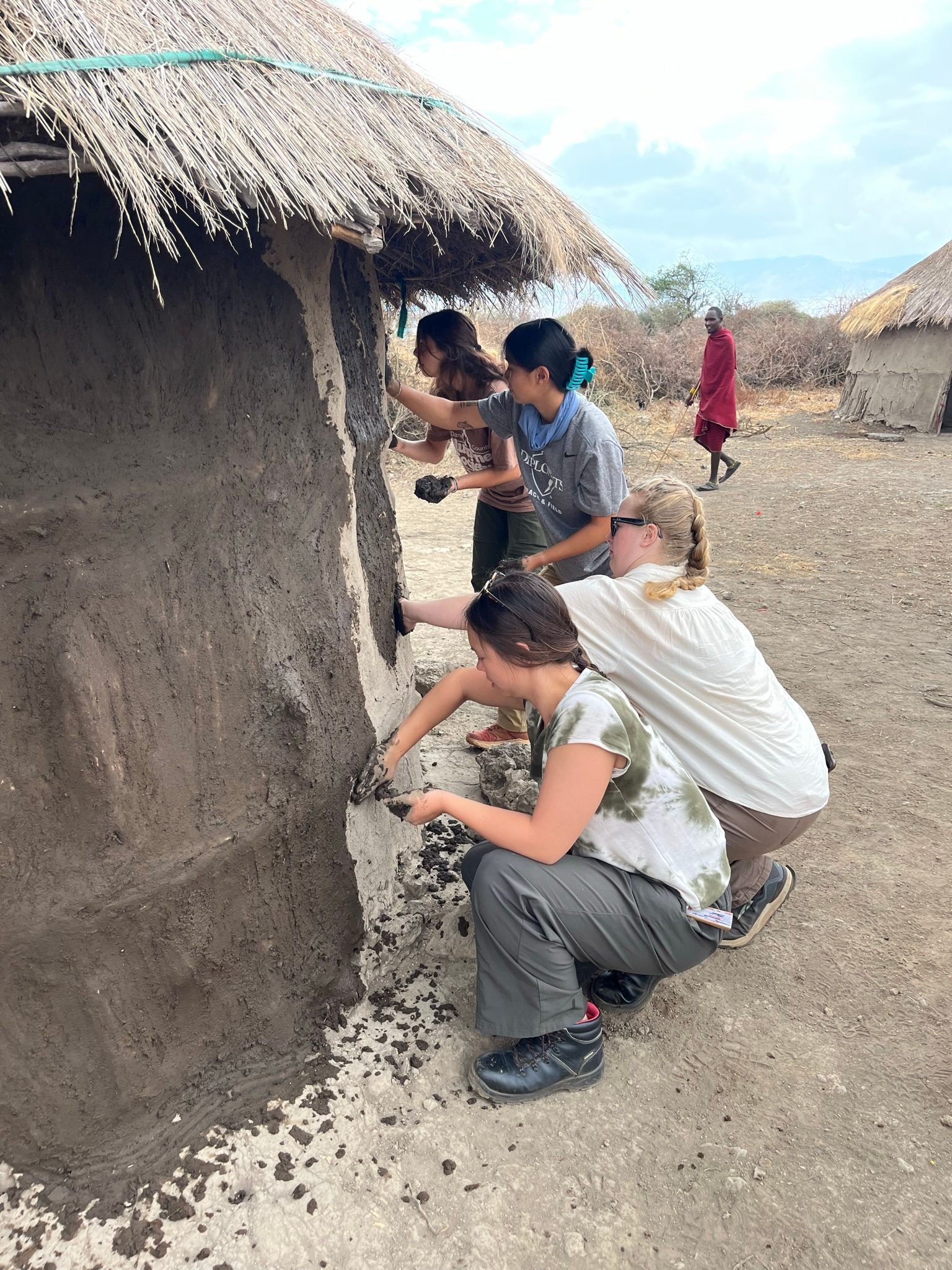 Gloria and classmates working outside