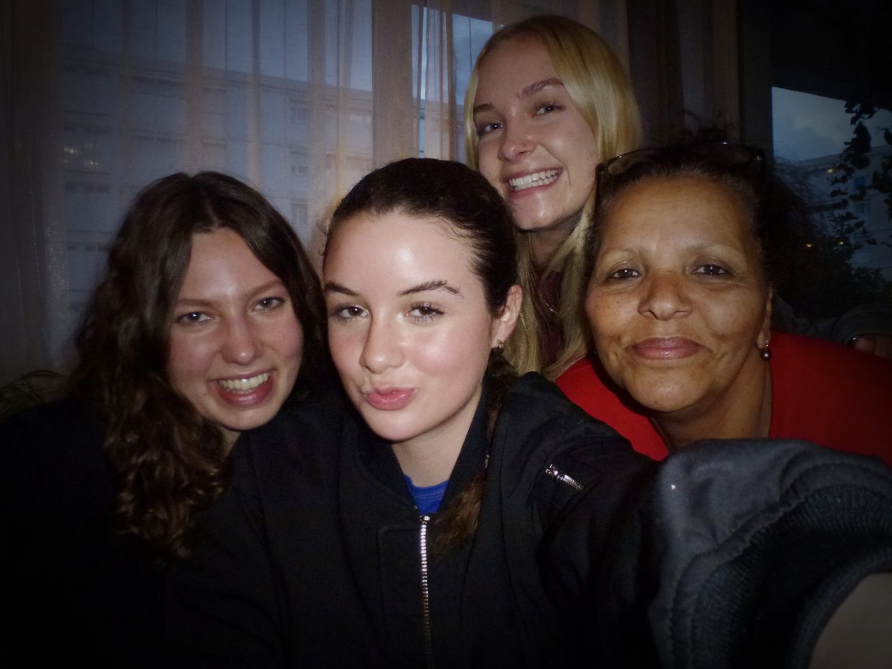 Selfie of Mariah with her host mother and roommates