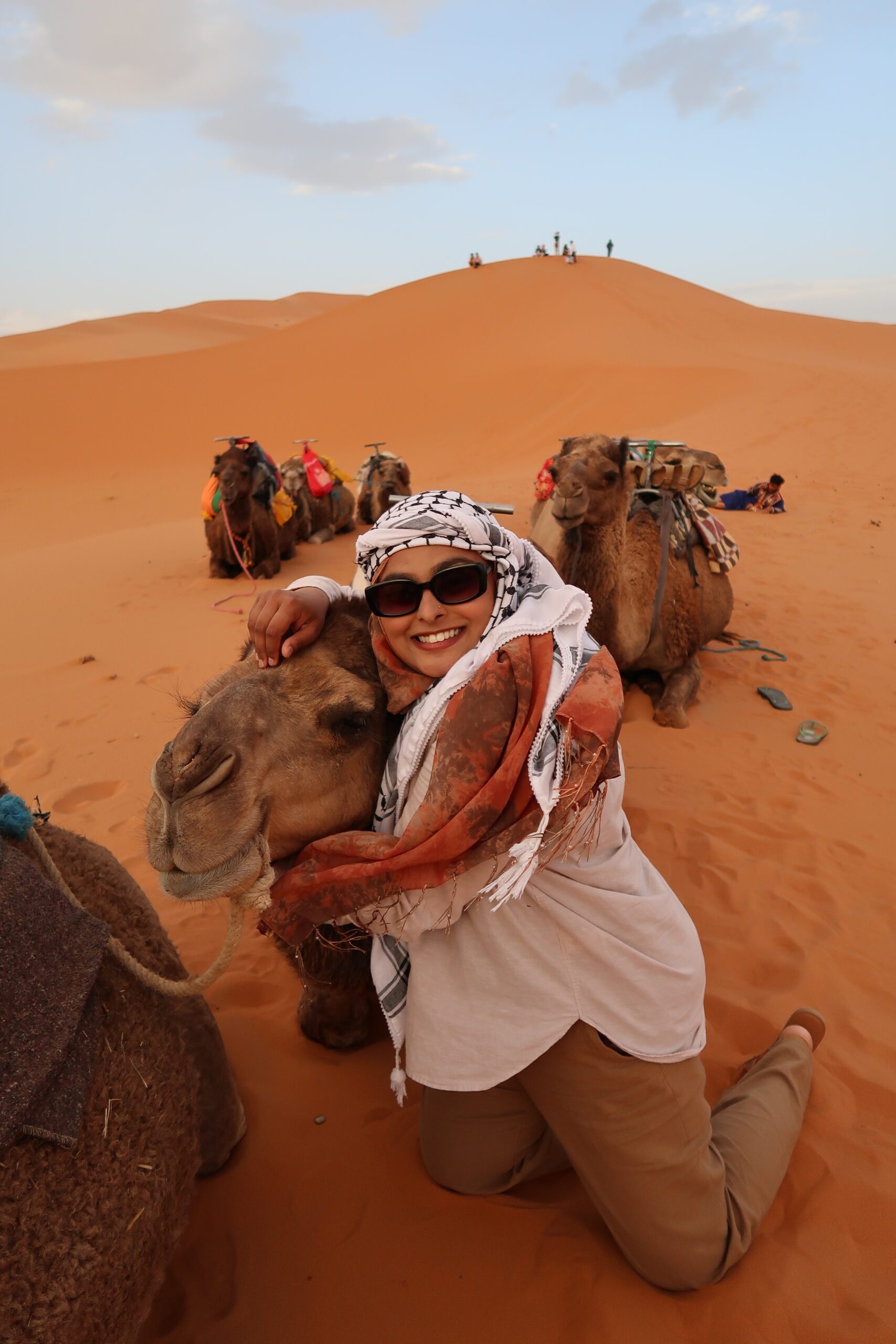 Mahmuda posing with camels
