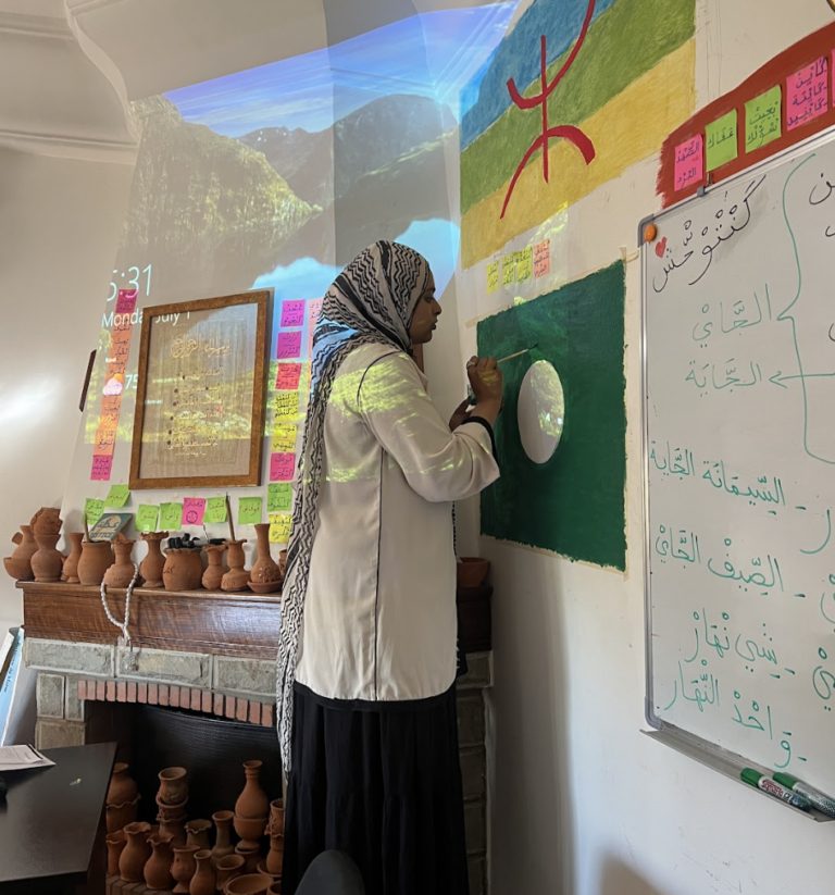 Mahmuda painting in a classroom