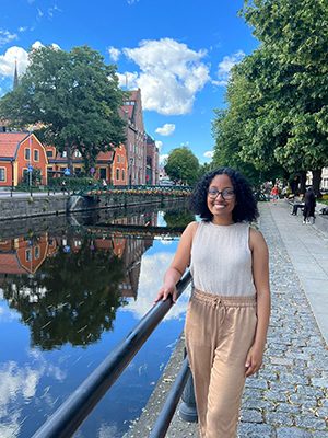 Feaven posing in front of a canal