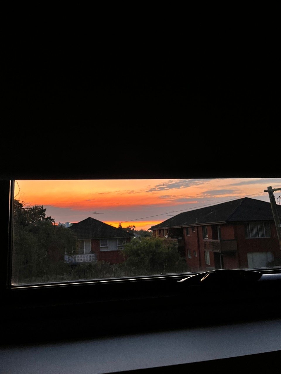 Sunset out a window
