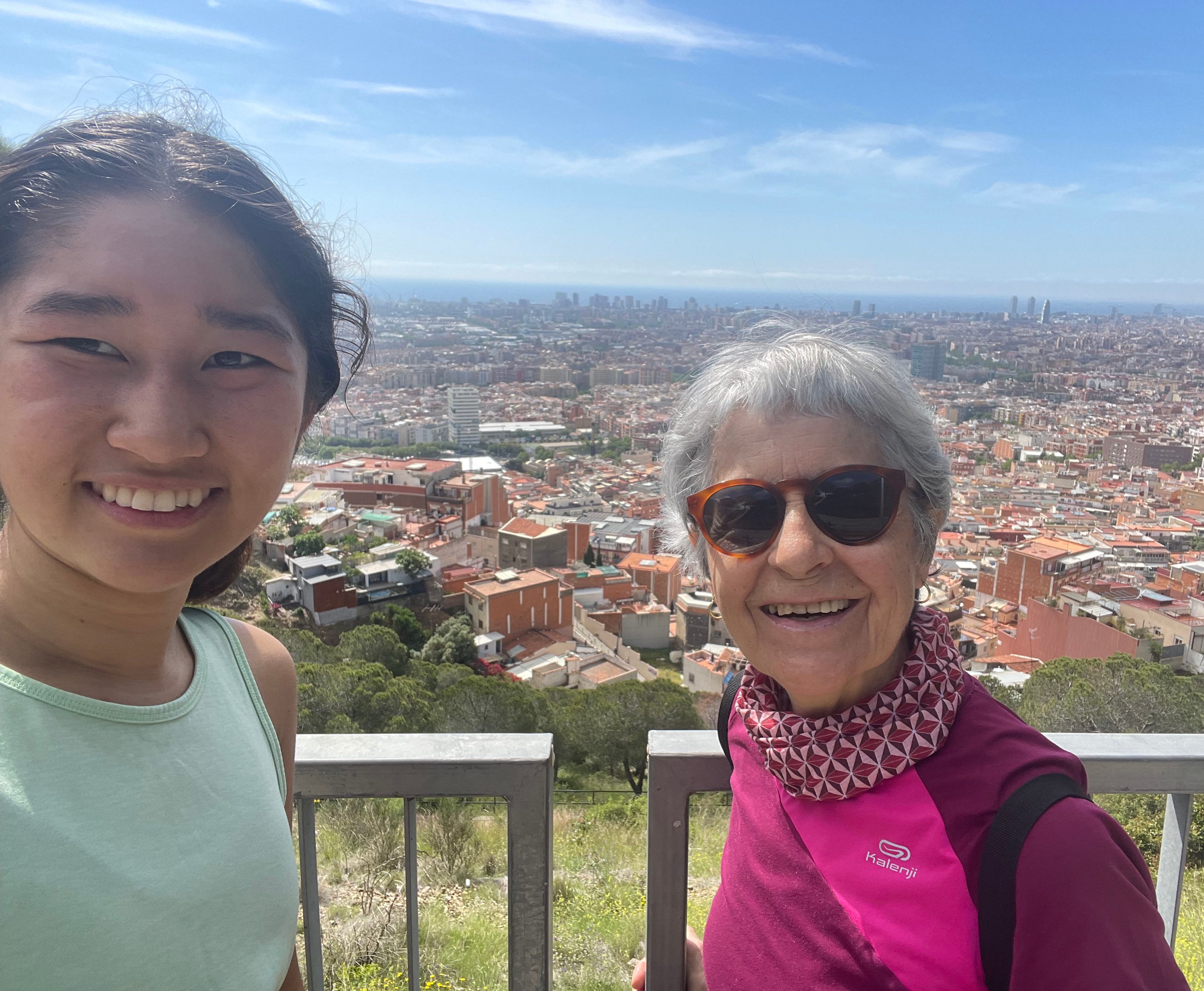 Selfie of Lily Wu at the top of a hike in Barcelona.