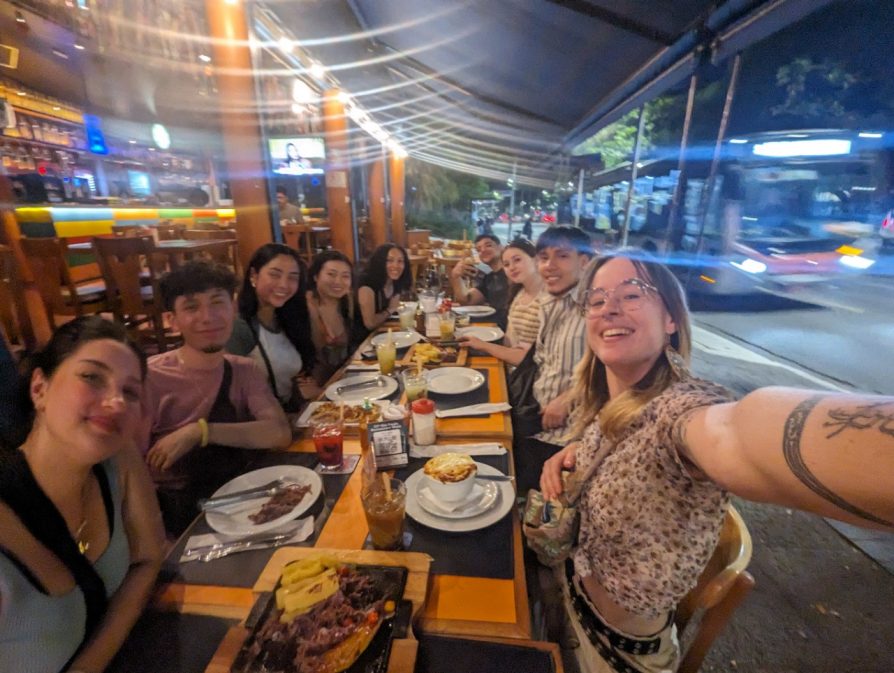 Group of students having dinner together