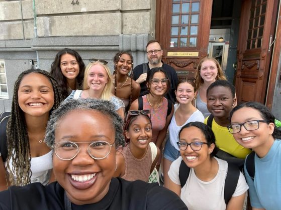 Class From Session Two (Copenhagen) - Students and staff cluster together for a smiling group photo.