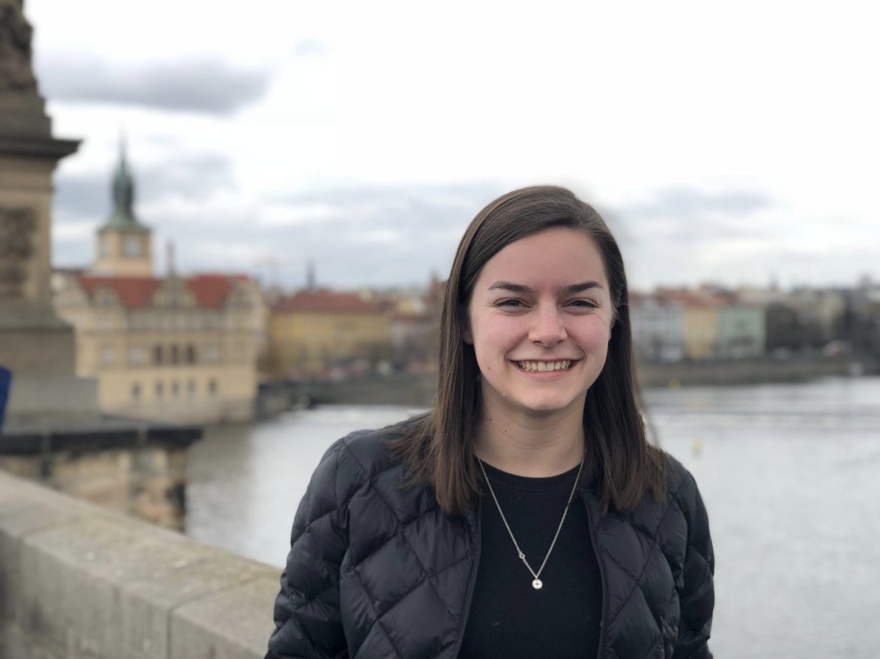 Margot poses for a photo on a bridge in Prague.