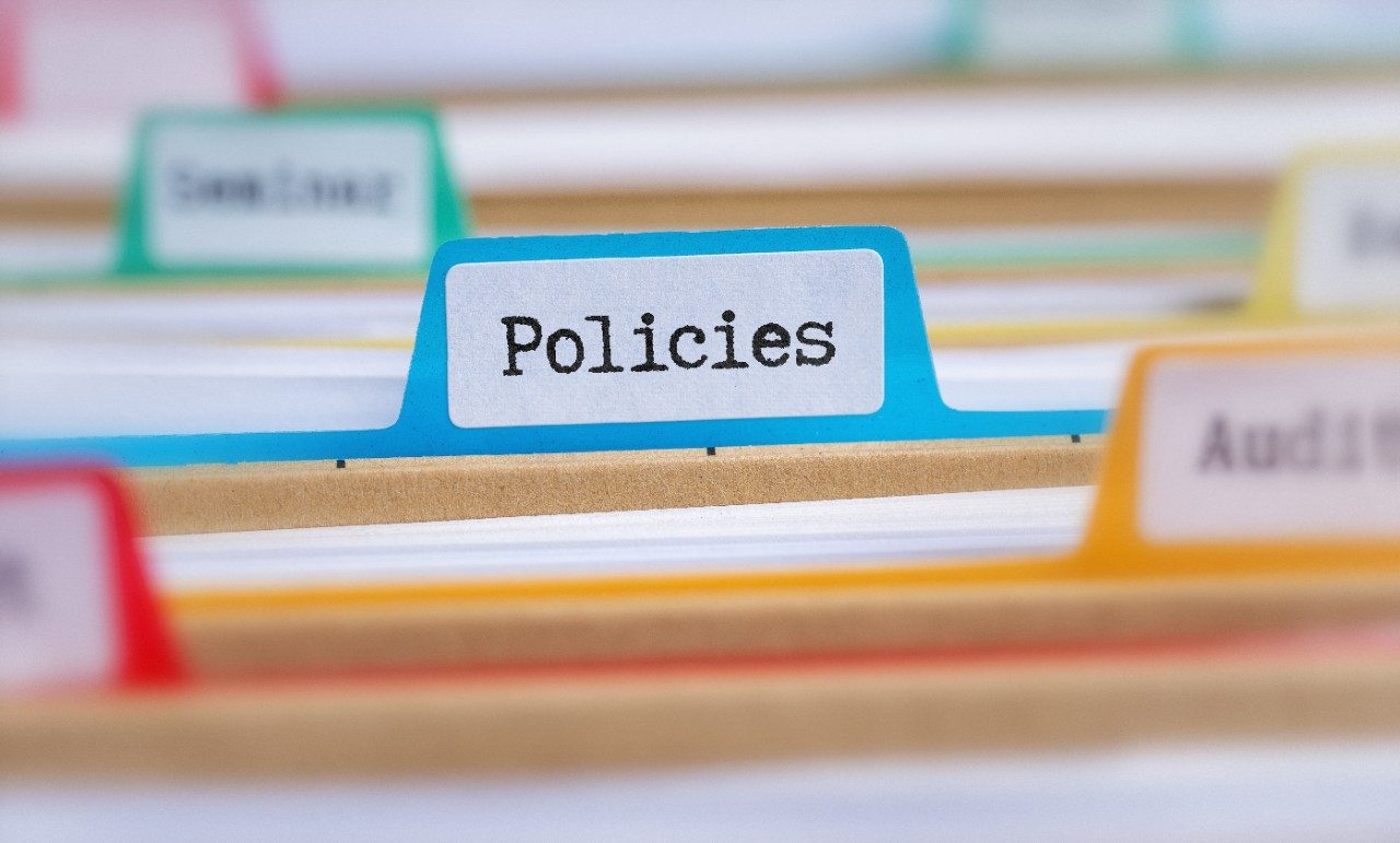 Colorful folders with labels, one of them being Policies