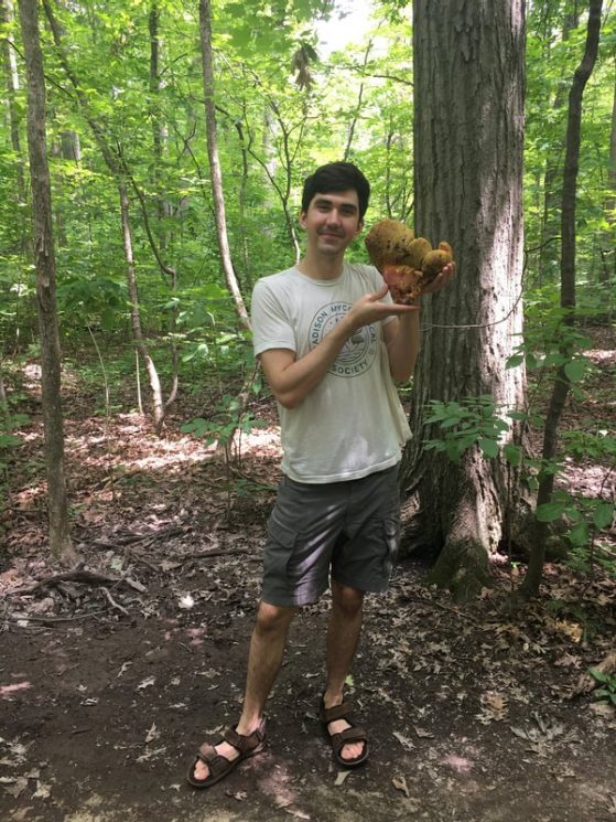 Picture from Alden's Website of him holding a mushroom 