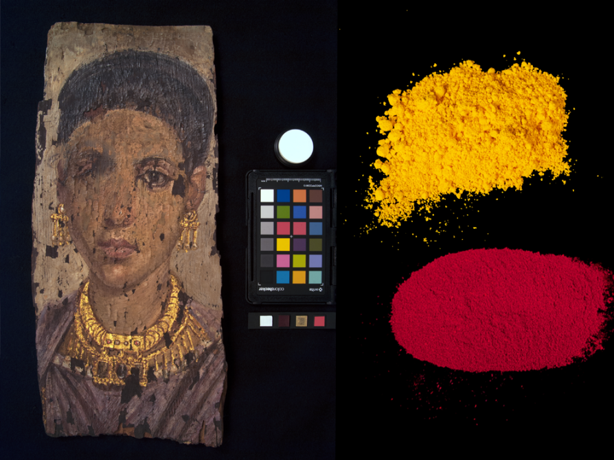 A black rectangle with a portrait of a woman on the left, a palette of colors in the middle beneath a white dot, and, on the right, two small piles of powder: an ochre powder on top and a red powder beneath it.