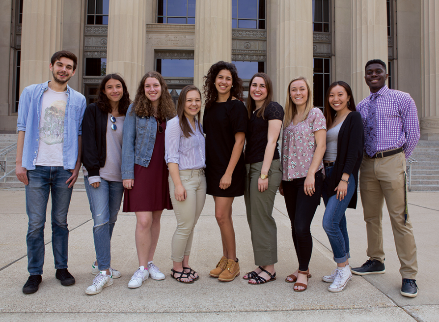 Nine students from the first Applebaum fellows cohort standing together in front of Angell Hall.