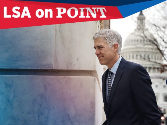 Photograph of Supreme Court nominee Neil Gorsuch taken from his left while he is walking into a building. There is a view of the U.S. capitol dome in the background behind him. A banner that says On Point runs across the top of the image.