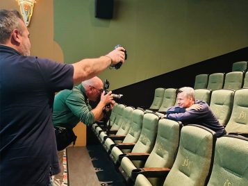 The Detroit News reporter and photographer taking photos of John Cameron Mitchell inside State Theatre.