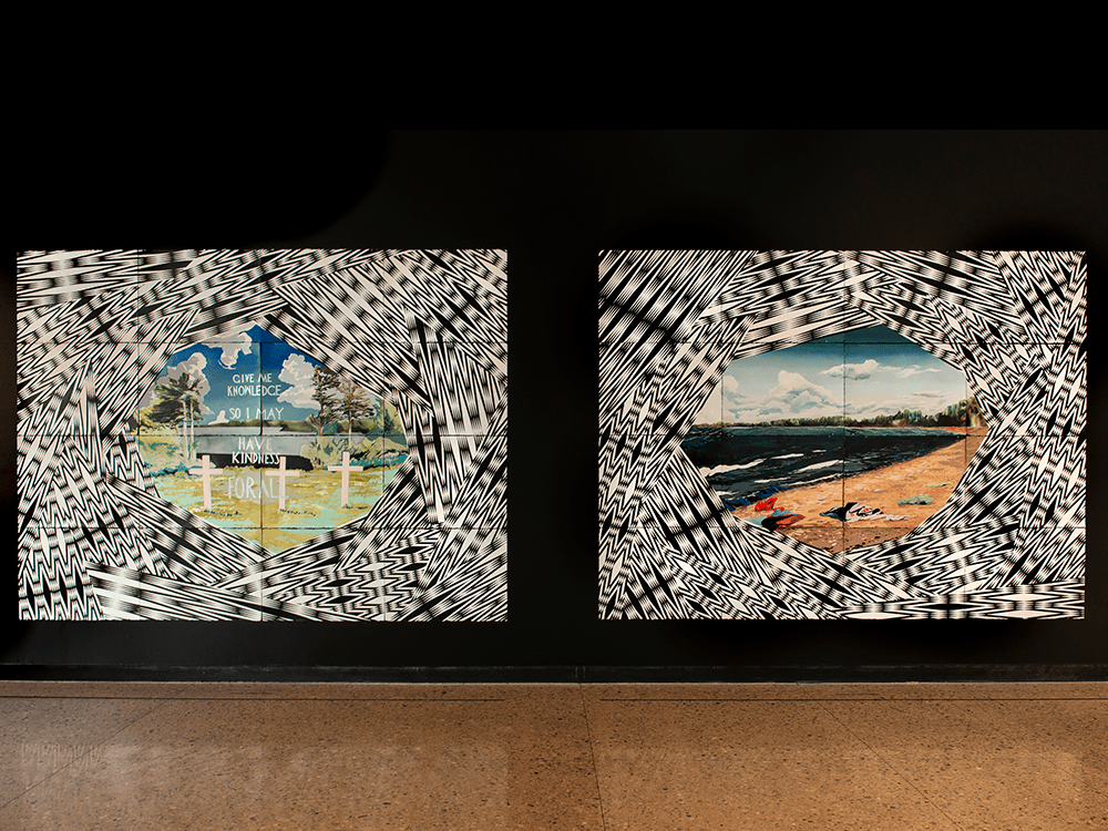 A photo of the two largest paintings in the Future Cache exhibition. A simple black wall stands behind the paintings and beige flooring sits beneath. On the left is I’ll Cut a Hole, a rendering of a geometric portal, opening out into the Burt Lake Band’s cemetery. In white text above the cemetery, the phrase “GIVE ME KNOWLEDGE SO I MAY HAVE KINDNESS FOR ALL” is written. On the right is the exhibition’s title painting Future Cache, a rendering of a similar geometric portal that opens out onto the shore of Burt Lake. Remnants of tourists, their clothes strewn about on the beach, are in the foreground, while the untouched forest and sky are in the distance.