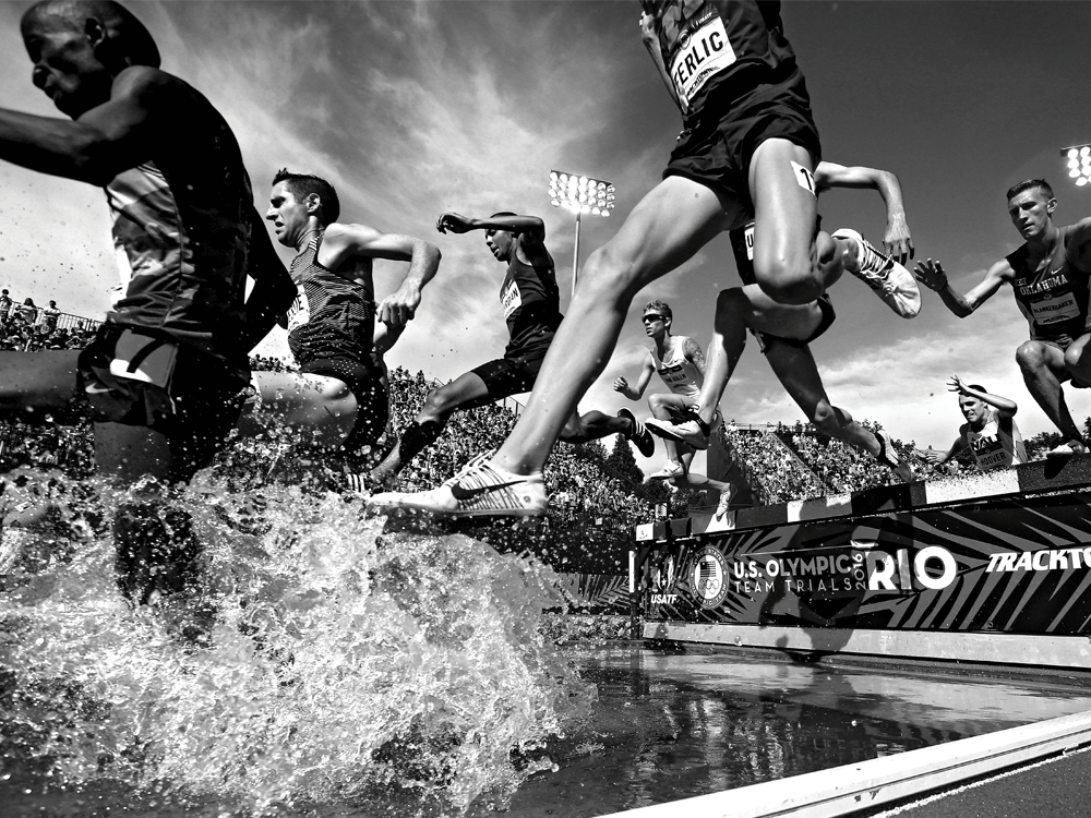 Ph.D. student Mason Ferlic competes in the steeplechase