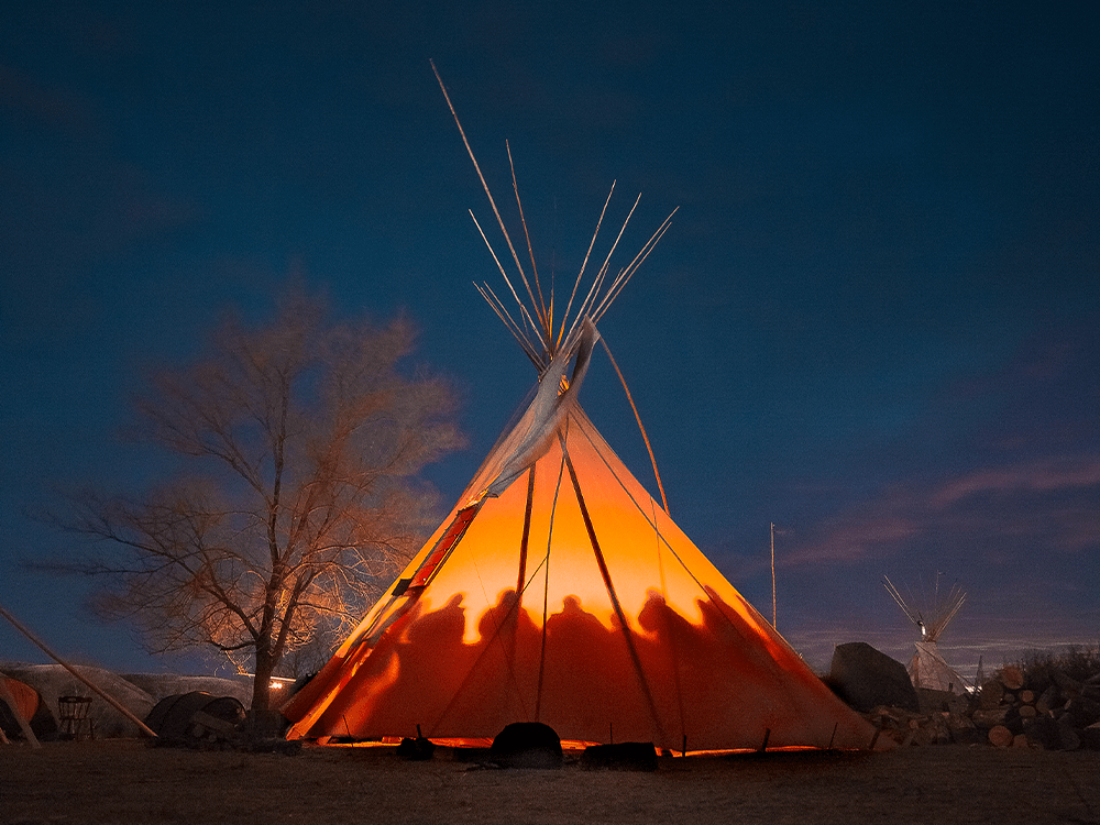 A teepee at night in Standing Rock