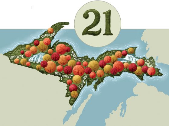 An illustration of the Upper Peninsula of Michigan features trees with fall colors against a green background as well as city names and waterfalls, and a stylized numeral 21.