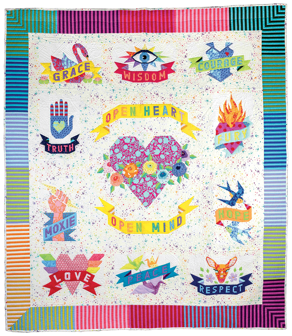 A quilt with a heart at the center and the words “open heart, open mind,” as well as grace, wisdom, courage, truth, fury, moxie, truth, love, peace, and respect, and a variety of related symbols.