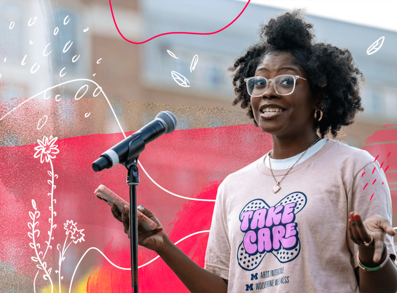 A woman wearing glasses and holding a smartphone speaks into a microphone. Red and white drawings, including flowers, are woven into the photo.