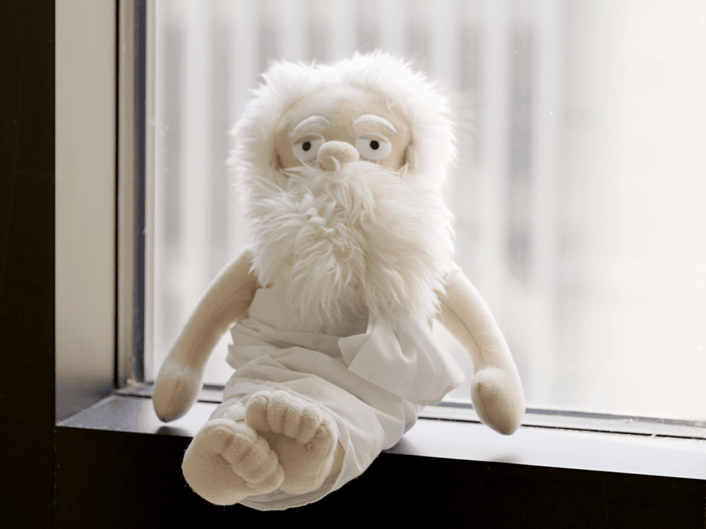 A white-bearded stuffie in a white toga sits on a window sill beside the words: Ahbel-Rappe’s beloved Socrates in stuffie form. “He’s the philosopher I love the most,” she says, “because he was Plato’s teacher.”  