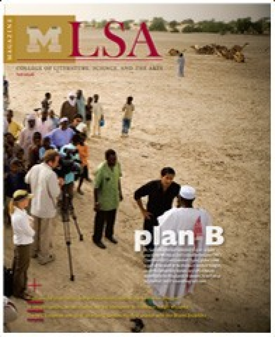 Cover of an issue of LSA Magazine from the University of Michigan’s College of Literature, Science, and the Arts. The scene is set in a dry, desert-like landscape, with a group of people gathered, some dressed in traditional African and Western clothing. A film crew with cameras is present, and several children and adults are standing or walking nearby. In the background, there are camels and sparse trees. The cover features the headline "plan B" in large white letters, along with additional article teasers at the bottom. The maize block "M" and red "LSA" logo are positioned at the top left.