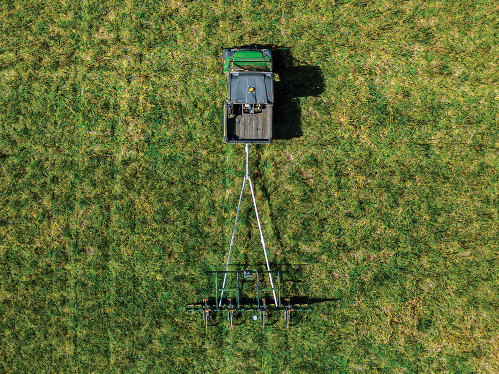 A bird’s-eye photograph of the magnetometer driving over a grassy field.