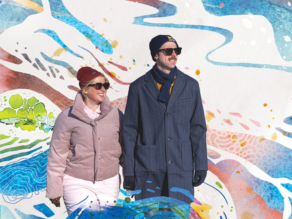 An illustration of blues and pinks suggests changing weather patterns. In the foreground is a photo of a couple in winter coats, hats, and sunglasses, holding hands and smiling.