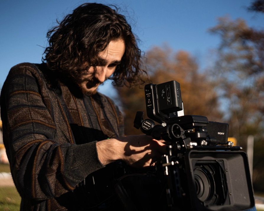 Photo of Nicklas wokring with film camera