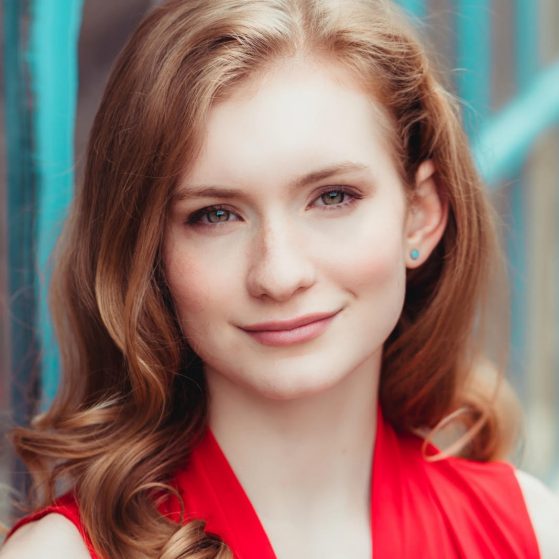 Photo of Claire in red blouse