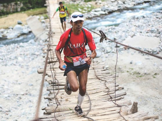 Kirsten took this photo of Omar Bouhrim running on a wooden bridge when covering the Trans Atlas Marathon in Morocco
