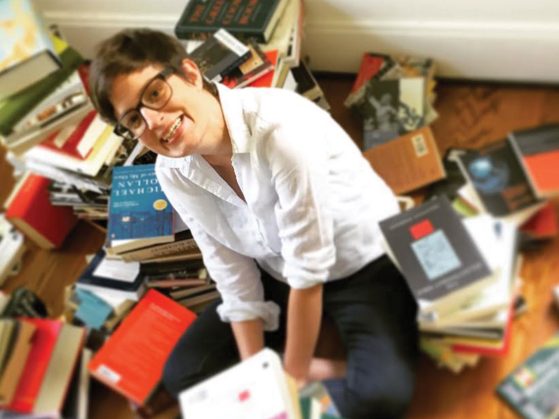 picture of Alice Goff surrounded by books