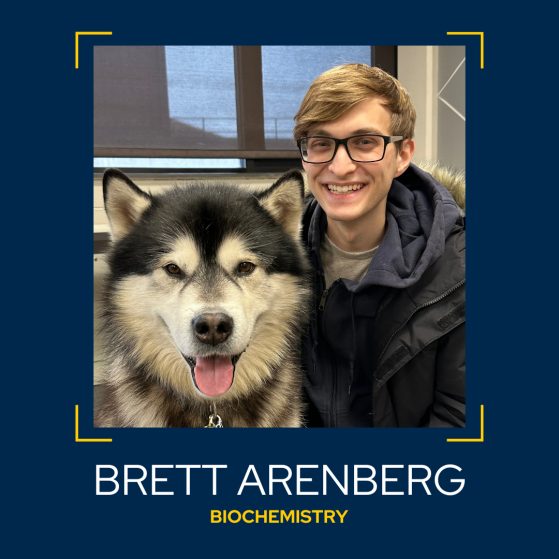 Image of Brett Arenberg posed with dog, Biochemistry major