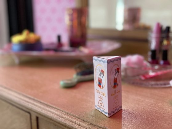 A small box sits atop a bedroom dresser.