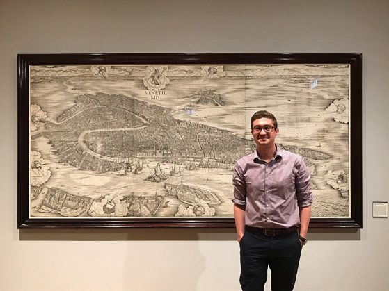 Student in front of 1500 map of Venice, Italy