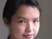 Professor Hui Deng in a pink sweater