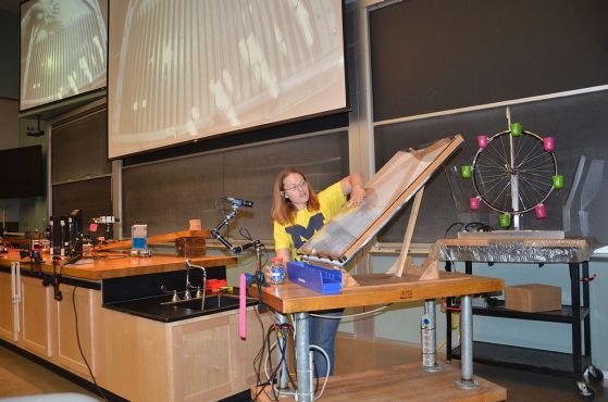 Monika Wood, Demolab Manager demonstrating an experiment at one of the Saturday Morning Physics talks.
