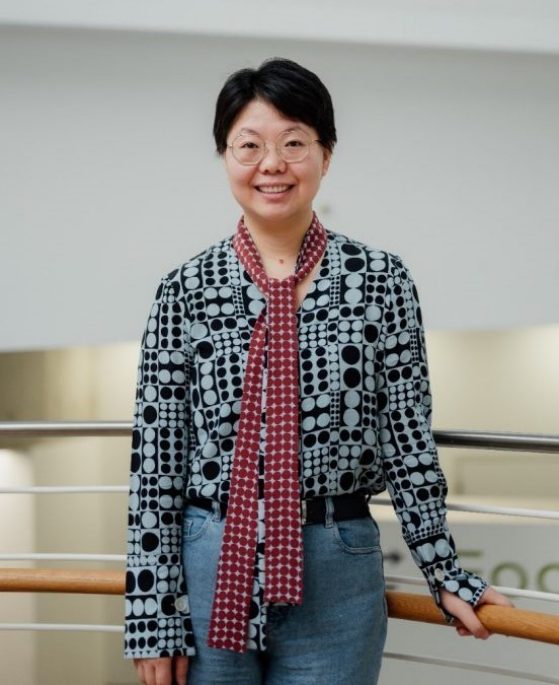 Physics Professor Liuyan Zhao with glasses and smiling