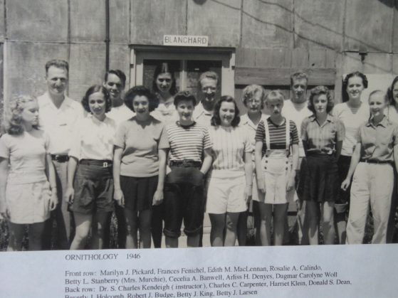 Black and white group photo of a class in front of a building