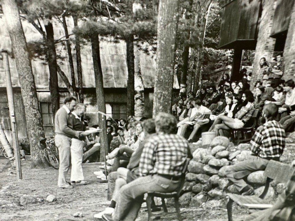 Man talking in front of group