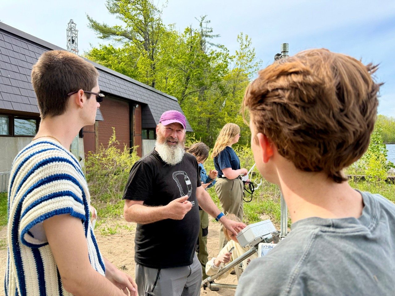 Three people talking together outside