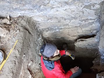 Prof. Raven Garvey excavating.